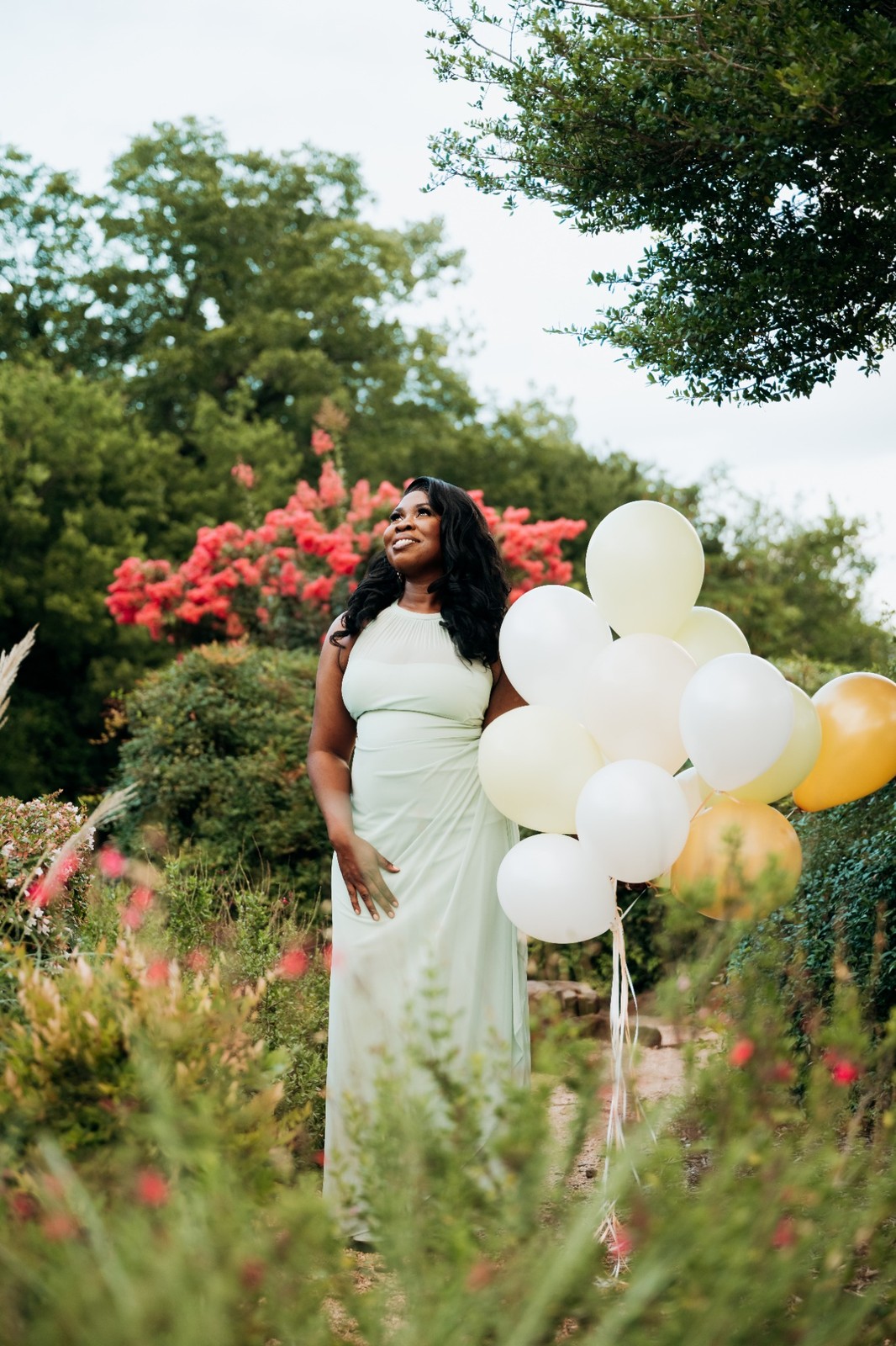 Birthday portrait with neutral balloons in the gardens at Keller Pointe